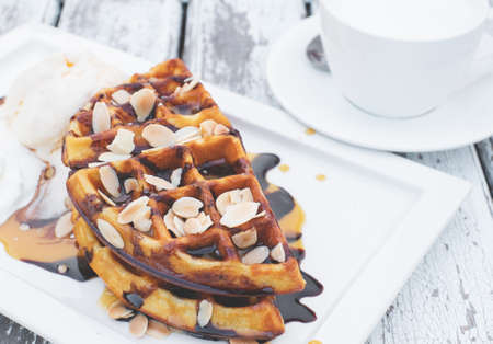 chocolate waffle on top with almond and fresh milkの写真素材