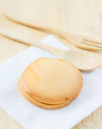 custard cake on wood tableの写真素材