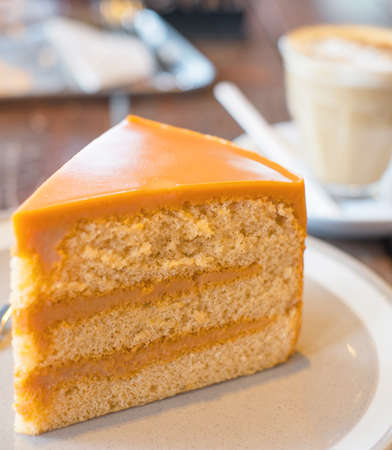 thai tea cake and hot coffeeの写真素材