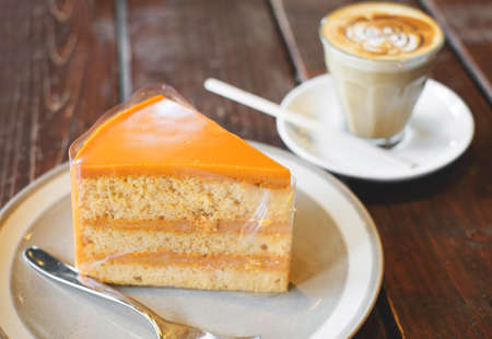 thai tea cake and hot coffeeの写真素材