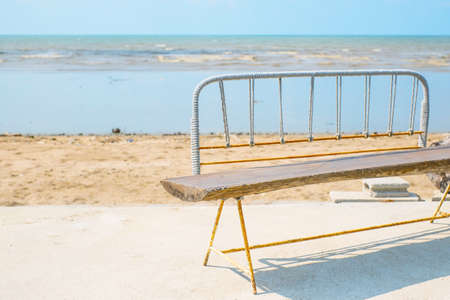 wooden chair beside the beachの写真素材