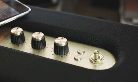 golden music controller button on vintage filter