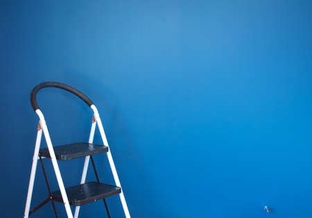 dirty chair on blue background, interior concept