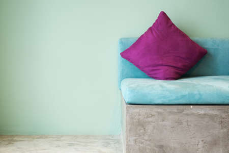 purple pillow on aqua sofa,interior conceptの写真素材
