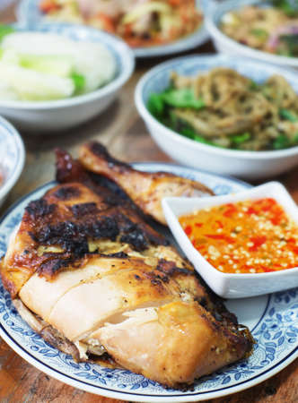 roasted chicken on wood table, thai styleの写真素材