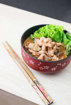spicy pork noodle, thai style call tomyumの写真素材