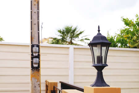 classic vintage lamp with electric pole backgroundの写真素材