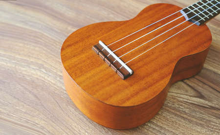 Retro guitar on wooden backgroundの写真素材