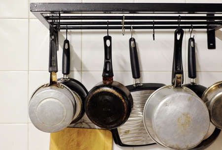 set of iron pan hanging on the wallの写真素材