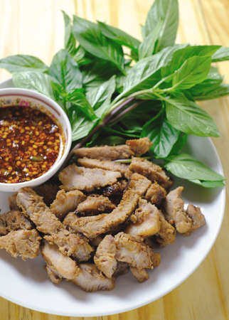 grill pork on wood table, thai styleの写真素材