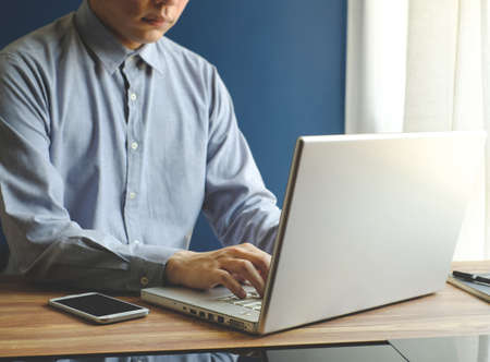 business man is working with laptop, mobile phone, notebookの写真素材