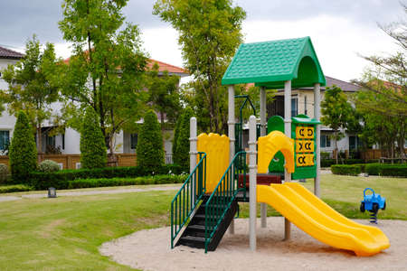 Outdoor children playground on green grass field