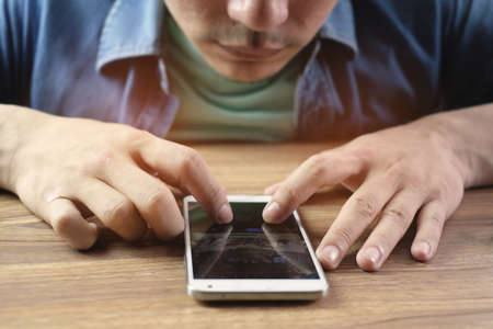 a man is playing mobile phone, business concept