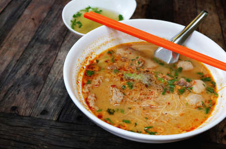 spicy noodle on wooden table, thai styleの写真素材