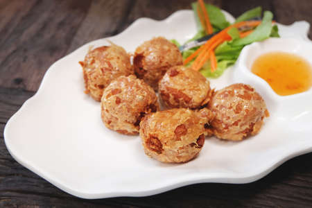 Deep Fried Crab Roll on white dishの写真素材