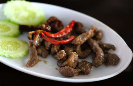 stir fried pork with herb and chiliの写真素材