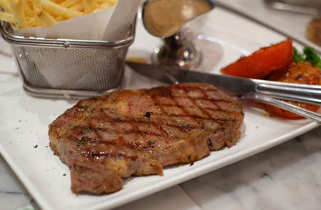 australia beef steak with tomato and frenchfriedの写真素材