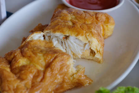 Closeup omelette crab on white dishの写真素材