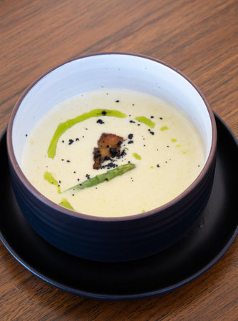 Traditional soup with creamy silky texture. Wood background. Copy space. Top view.の写真素材