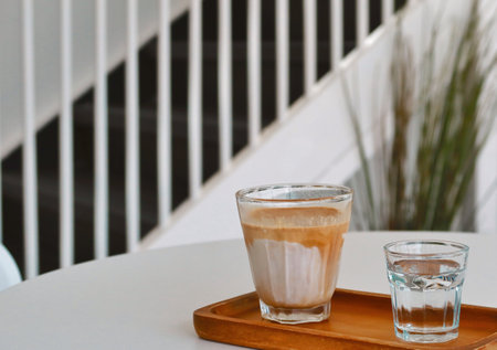Iced dirty coffee with white backgroundの写真素材