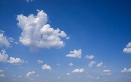 Summer light white clouds on a blue sky.の写真素材