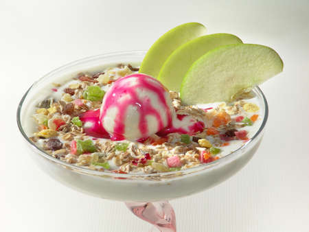 Exotic fruits in a glass with ice cream.