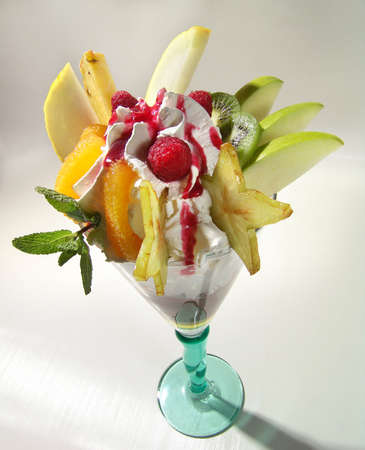 Exotic fruits in a glass with ice cream.の写真素材