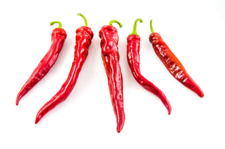 Red hot chili peppers on a white background.の写真素材