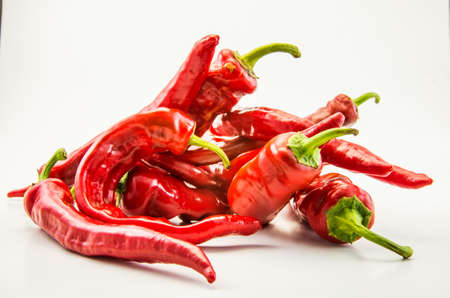Red hot chili peppers on a white background.
