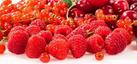 Assorted berry on a white background. Cherries, raspberries, red currants.