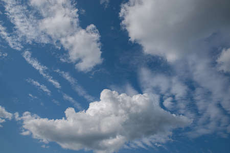 Blue sky with clouds and sun.の写真素材