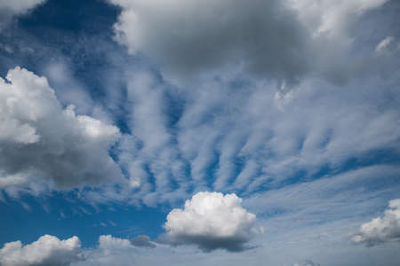 Blue sky with clouds and sun.の写真素材