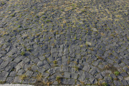 abstract background of cobblestone pavement of stone blocksの写真素材