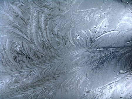 Frosty winter background photo of ice buildup on a window