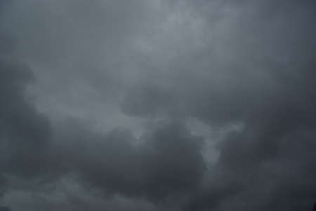 Dark clouds in an alarming sky.の写真素材