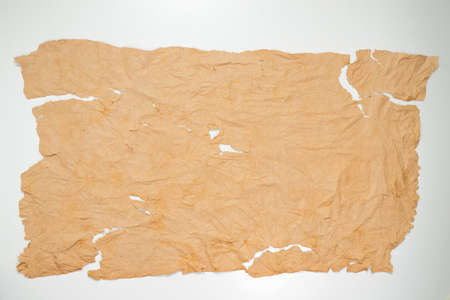 Old grunge paper texture The texture of the paper is wet, old, yellowed with time. Torn, stained.の写真素材