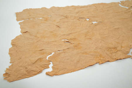 Old grunge paper texture The texture of the paper is wet, old, yellowed with time. Torn, stained.の写真素材