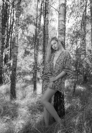 Lutsk. Ukraine. August 25, 2019; Beautiful blonde girl in a birch forest. Selective focus. Soft focus. Blurred background.のeditorial素材