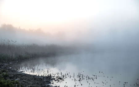 Mornings fog over the lakeの写真素材