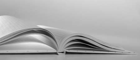 An expanded notebook for notes. Selective focus. Blurred background.