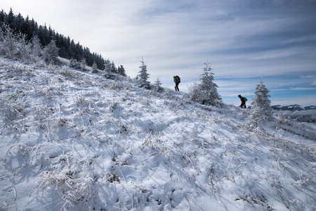 Carpathians. Ukraine. March 13, 2020; Tourists in the snowy mountains.のeditorial素材