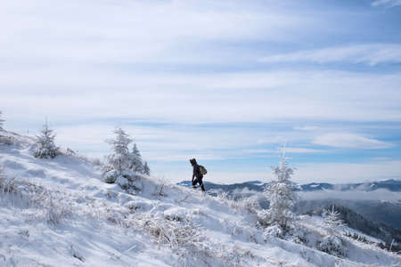 Carpathians. Ukraine. March 13, 2020; Tourists in the snowy mountains.