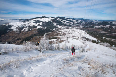 Carpathians. Ukraine. March 13, 2020; Tourists in the snowy mountains.のeditorial素材