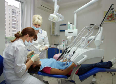 Lutsk. Ukraine. July 16, 2008; Doctors dentists treat teeth to a patient in a medical office.のeditorial素材