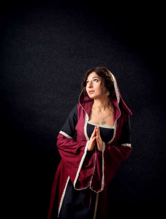 Portrait of a girl in medieval dress. Historic costume.の写真素材