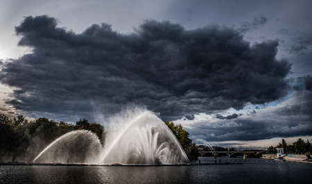 A cloud above the fountain in Vinnitsa, Ukraine.の写真素材