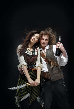 A guy and a girl in pirate costumes.の写真素材