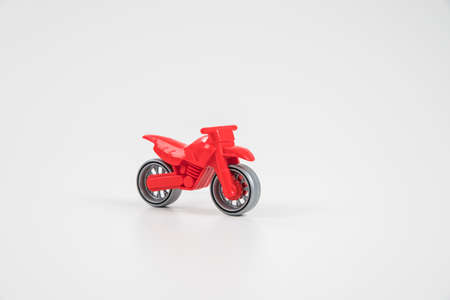 Multicolored plastic toy car. Motorcycle.