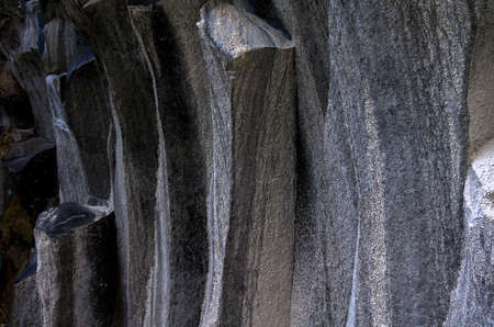 Basalt rocks texture. close-up. Beautiful colored hexagonal stone formations.の写真素材