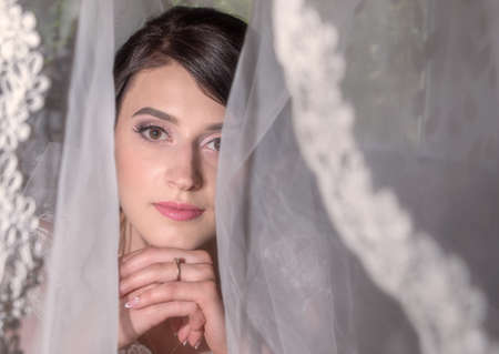 The bride at the wedding under the veil.の写真素材